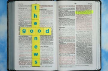 a book with a cross made out of yellow paper