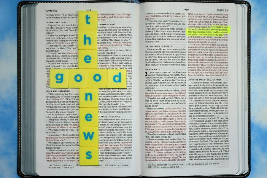 a book with a cross made out of yellow paper