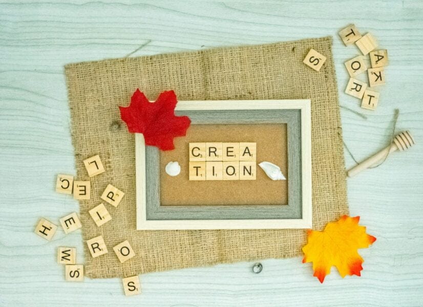 a picture frame with the word creation spelled in scrabble letters