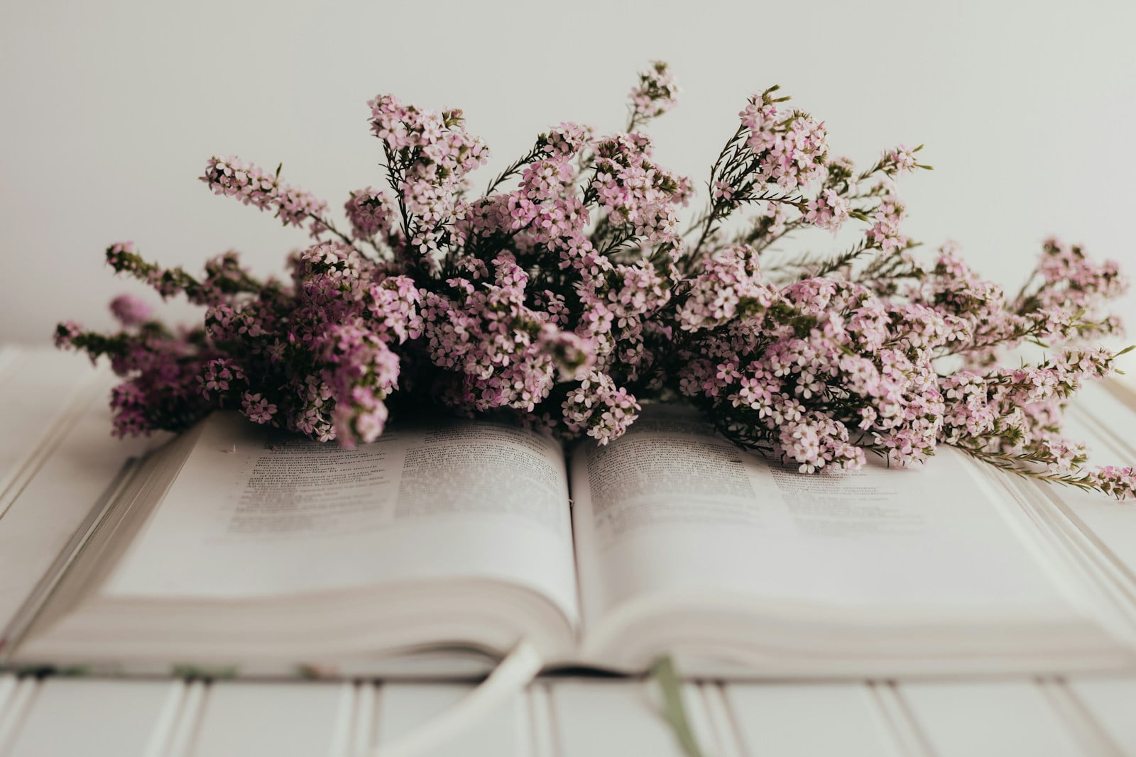 a book with a bunch of flowers on top of it