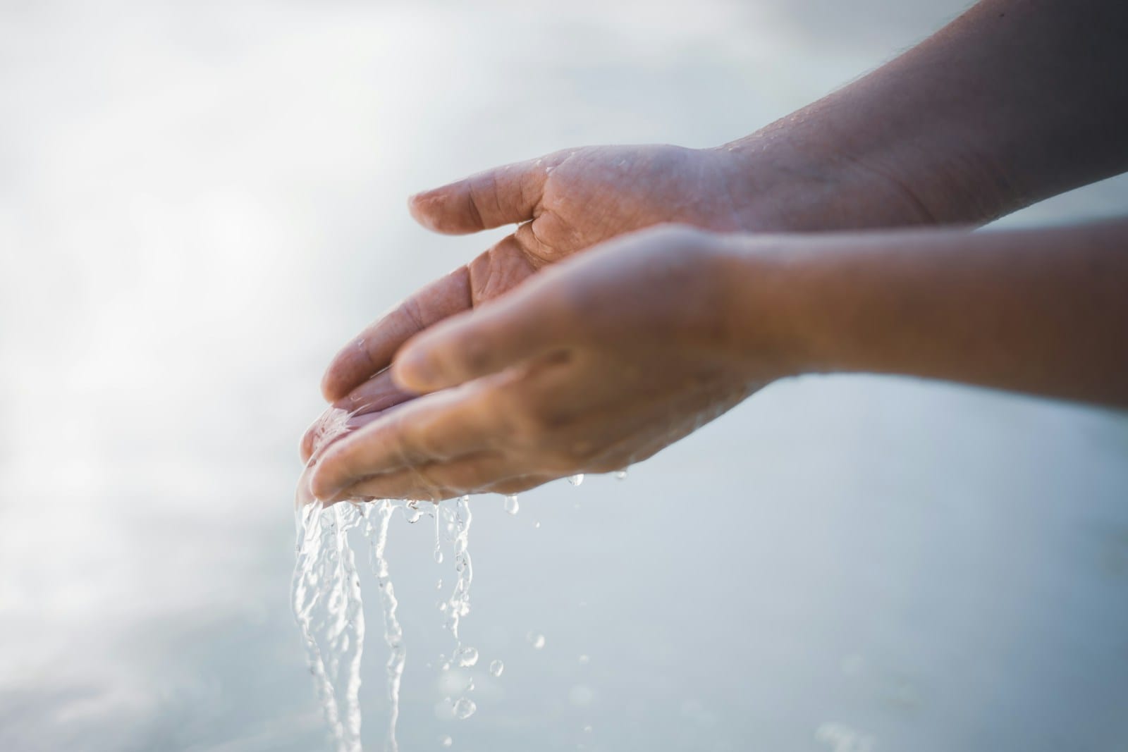 a close-up of hands shaking